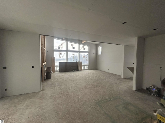 unfurnished living room with carpet