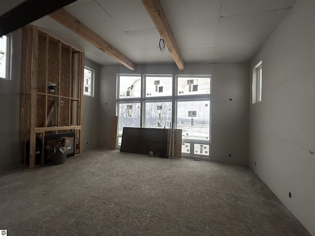 miscellaneous room featuring beam ceiling