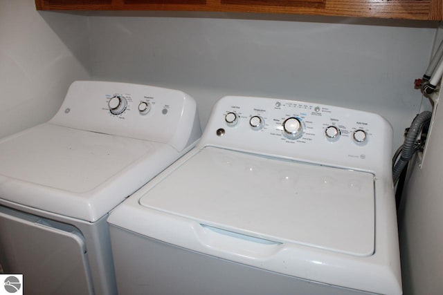 laundry area with independent washer and dryer and laundry area