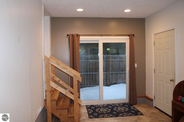 doorway to outside featuring recessed lighting