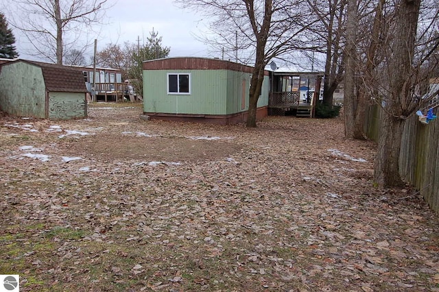 view of yard with a storage unit