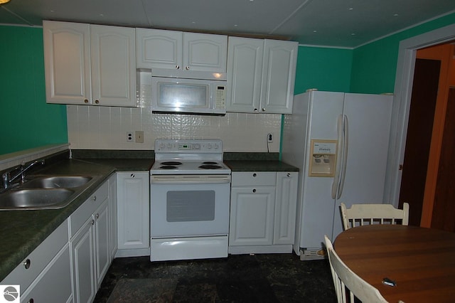 kitchen with white cabinets, decorative backsplash, white appliances, and sink