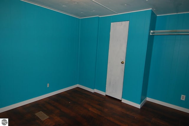 unfurnished bedroom featuring hardwood / wood-style flooring