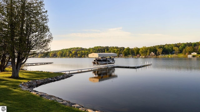 property view of water with a dock