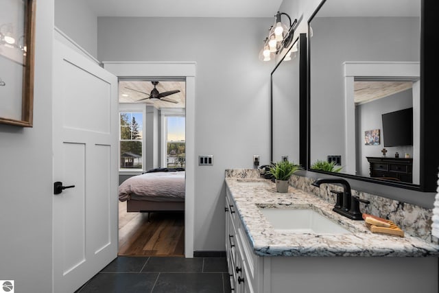 bathroom featuring hardwood / wood-style floors, vanity, and ceiling fan