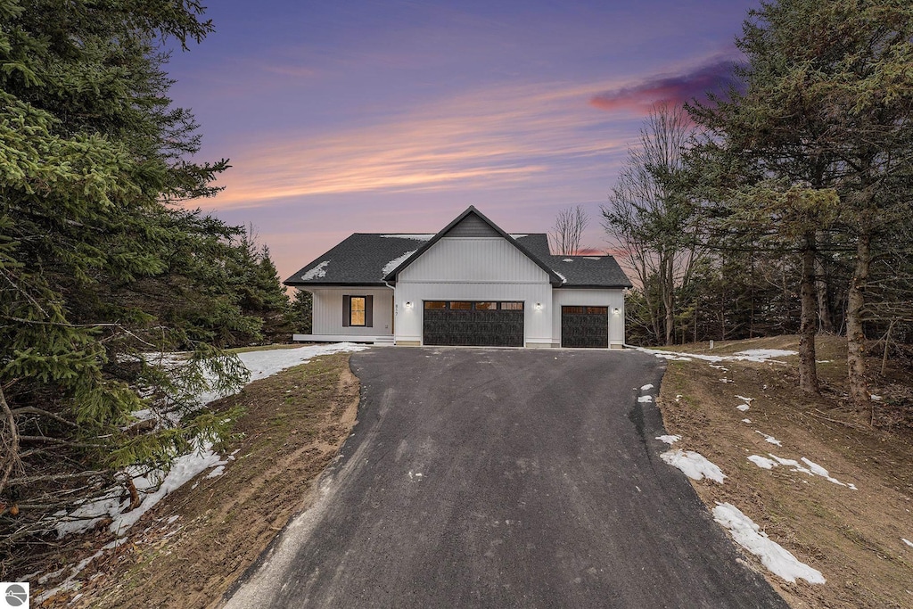 modern farmhouse featuring a garage