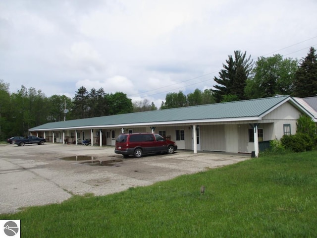 421 N Michigan Ave, Manton, MI 49663 - exterior space featuring a front yard