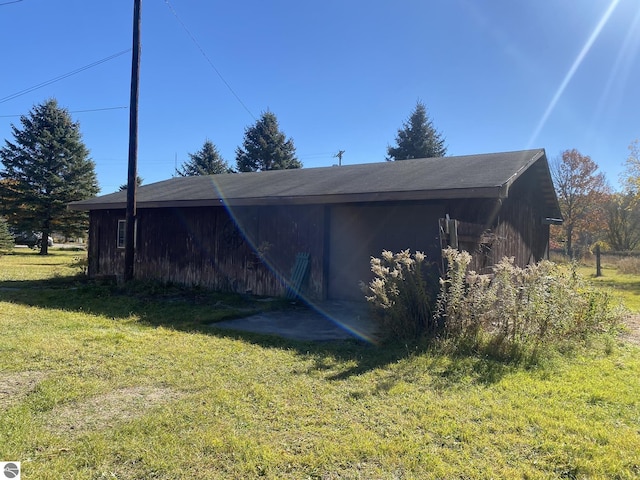 421 N Michigan Ave, Manton, MI 49663 - view of side of home with a lawn