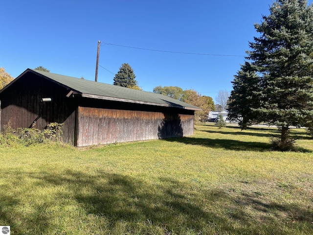 421 N Michigan Ave, Manton, MI 49663 - view of side of property featuring a yard