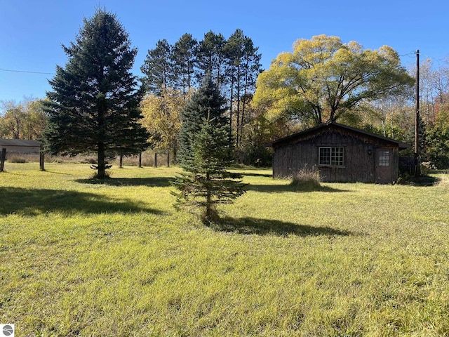 421 N Michigan Ave, Manton, MI 49663 - view of yard with an outdoor structure