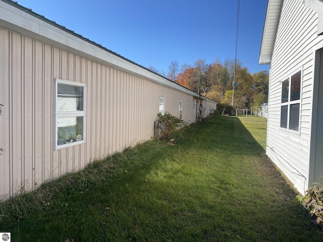 421 N Michigan Ave, Manton, MI 49663 - view of side of property featuring a yard