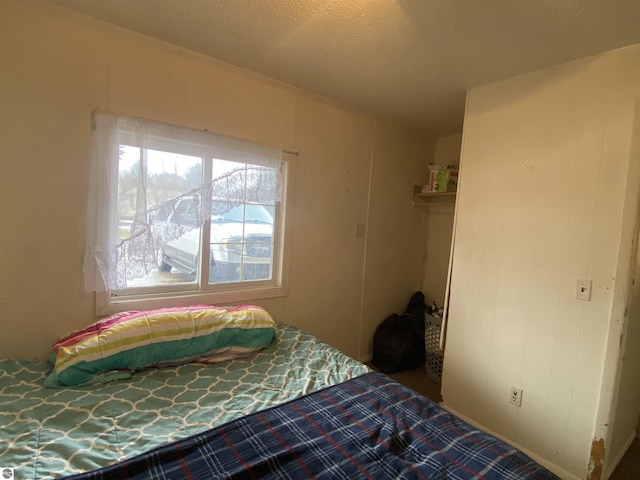 421 N Michigan Ave, Manton, MI 49663 - bedroom featuring a textured ceiling