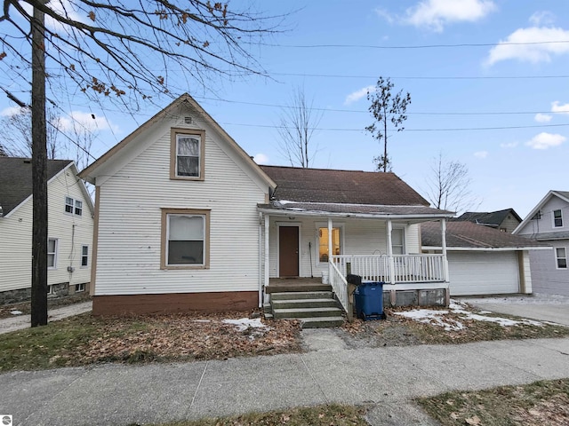 view of front of house featuring a garage and covered porch