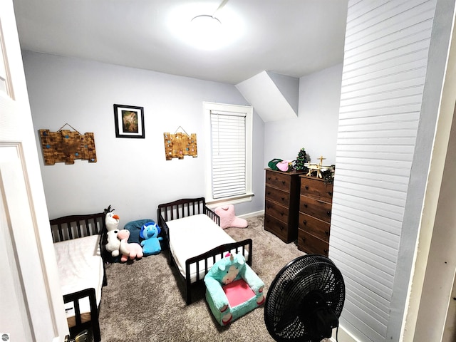 carpeted bedroom featuring vaulted ceiling