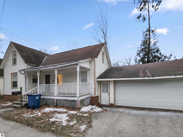 view of front of home featuring covered porch and a garage