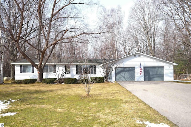 view of front of home with a front lawn and a garage