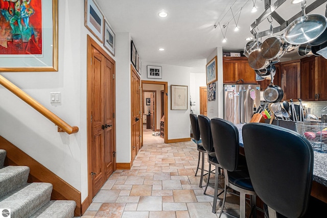 kitchen with backsplash and high quality fridge