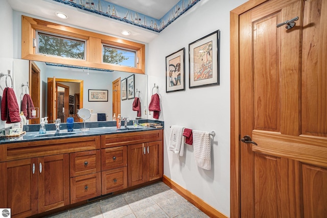 bathroom featuring tile patterned flooring and vanity