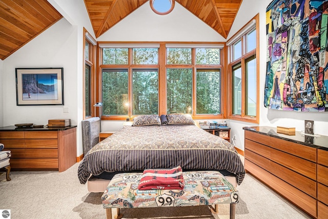 bedroom featuring lofted ceiling with beams, wooden ceiling, and carpet floors