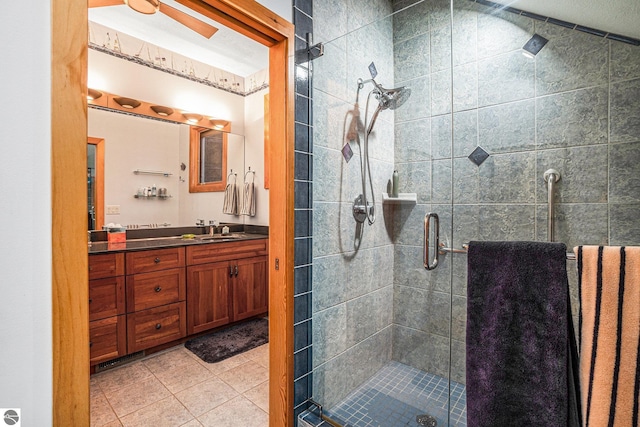 bathroom featuring vanity, tile patterned floors, and a shower with shower door