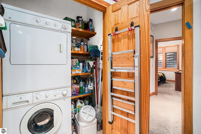 washroom with carpet flooring and stacked washer and dryer