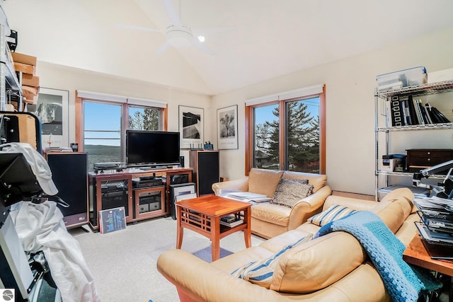 living room with light carpet, vaulted ceiling, a wealth of natural light, and ceiling fan