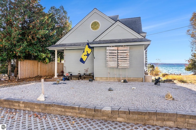 view of front of property with a water view