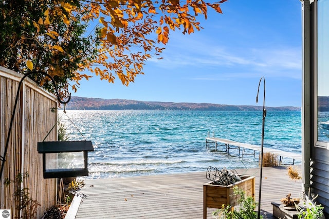 dock area with a water and mountain view