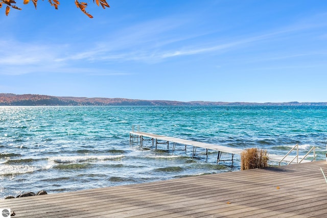 dock area featuring a water and mountain view