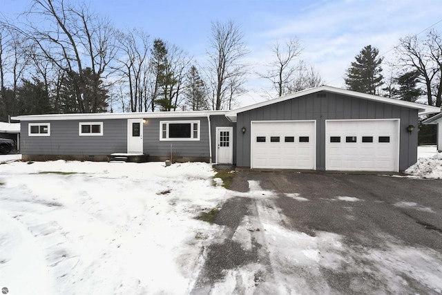 ranch-style home featuring a garage