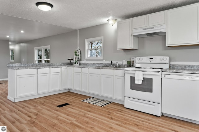 kitchen with white cabinetry, sink, white appliances, and light wood-type flooring