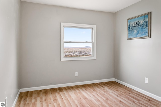 unfurnished room with light hardwood / wood-style flooring