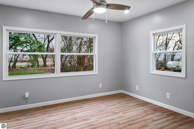 spare room featuring ceiling fan and light hardwood / wood-style floors