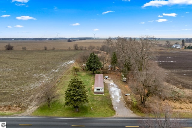 birds eye view of property with a rural view