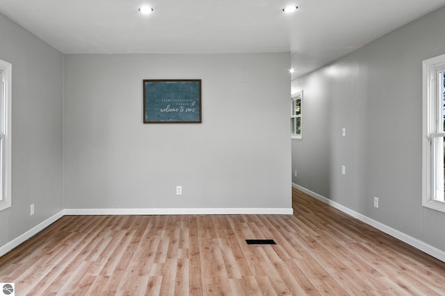 unfurnished room featuring light wood-type flooring