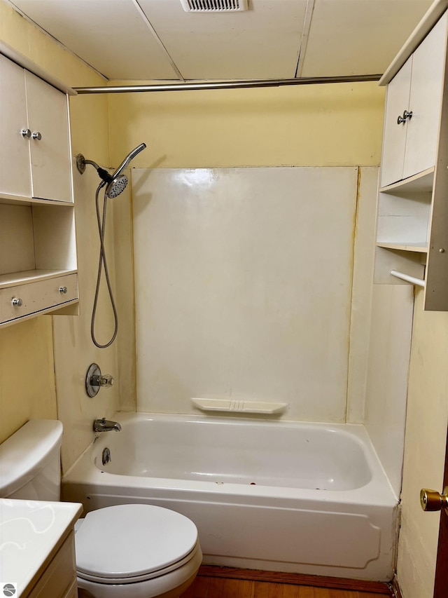 full bathroom featuring vanity, toilet, and washtub / shower combination