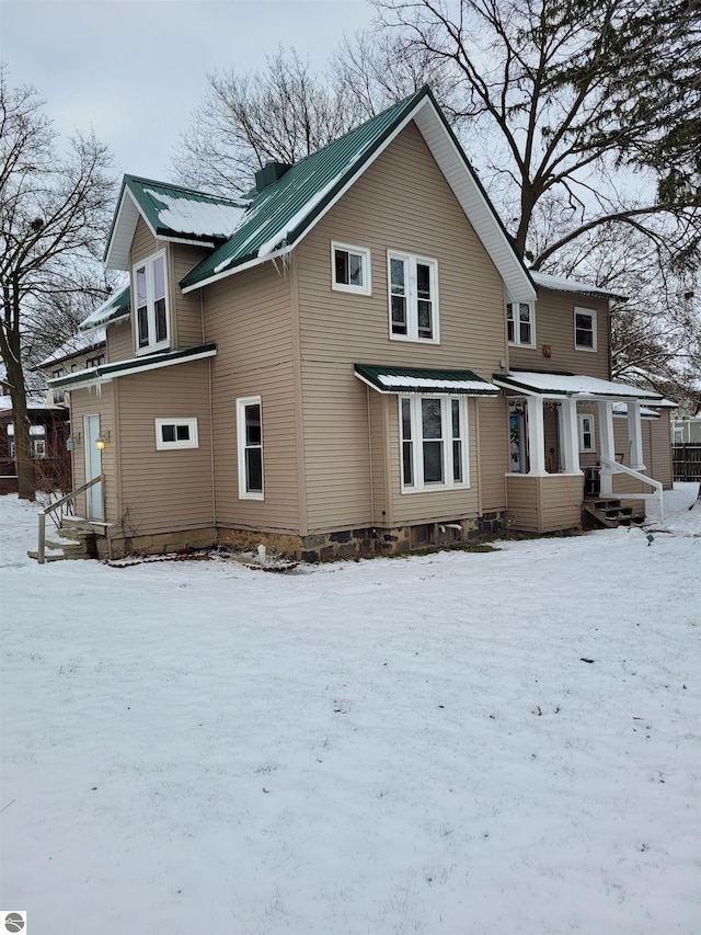 view of snow covered property