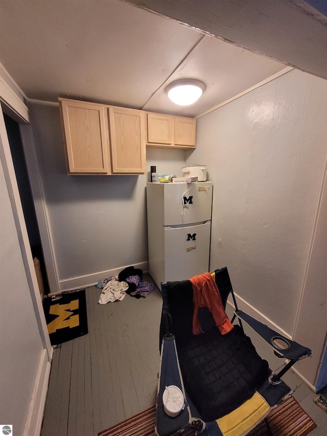 interior space featuring white refrigerator and wood-type flooring