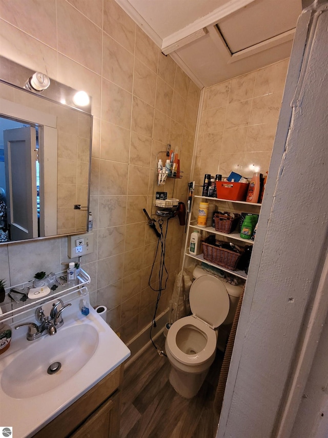 bathroom featuring vanity, backsplash, toilet, tile walls, and wood-type flooring