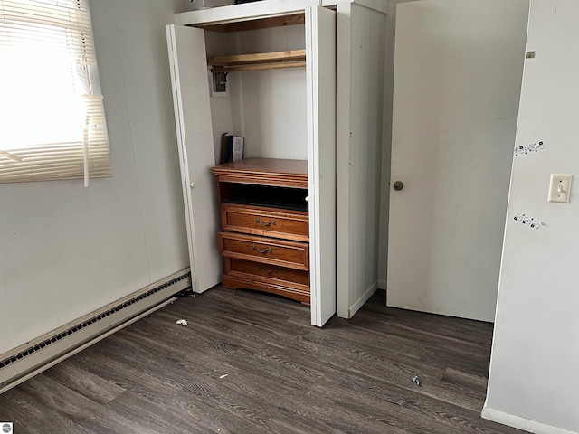 closet with a baseboard heating unit