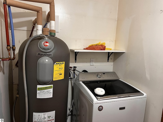 clothes washing area with washer / dryer and electric water heater