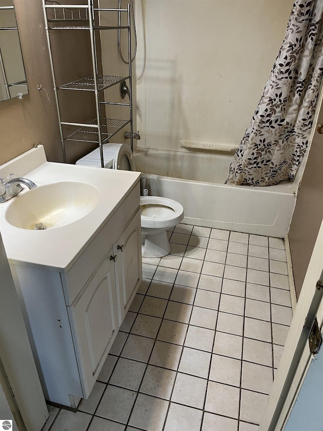 full bathroom featuring tile patterned floors, vanity, shower / tub combo, and toilet