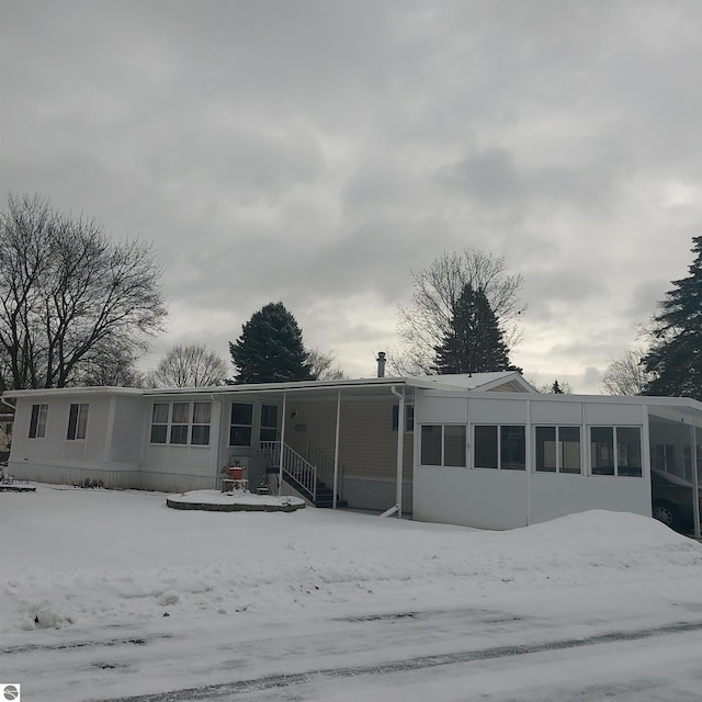 view of snow covered house