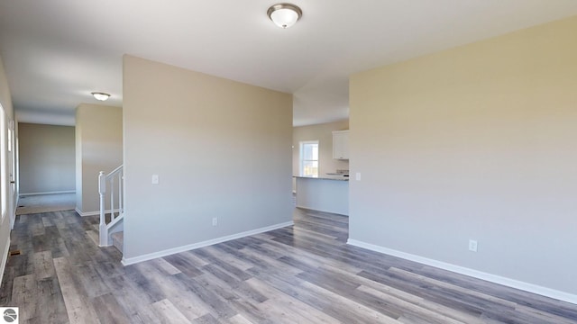 unfurnished room with light wood-type flooring