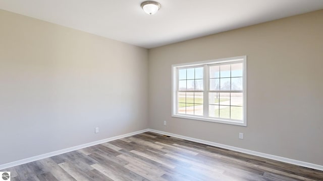 unfurnished room featuring light wood-type flooring