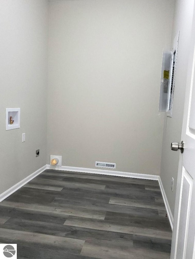 laundry area featuring dark wood-type flooring and washer hookup