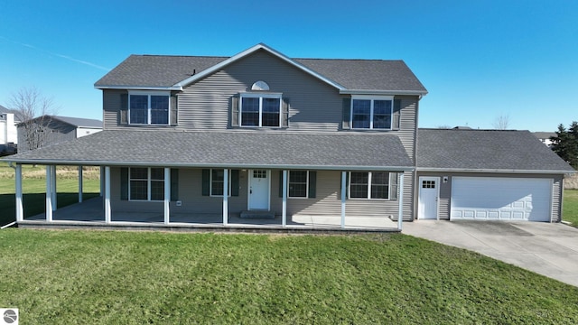 view of front of property with a porch, a garage, and a front lawn