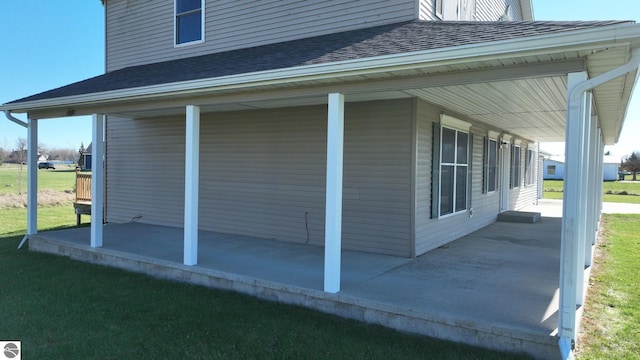 view of side of home with a porch and a patio