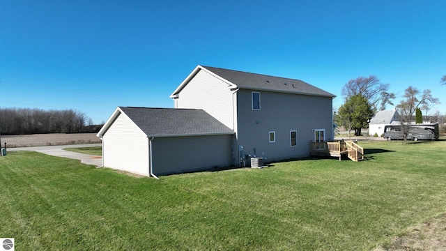 back of house with a lawn