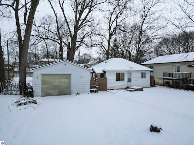 exterior space with an outbuilding and a garage